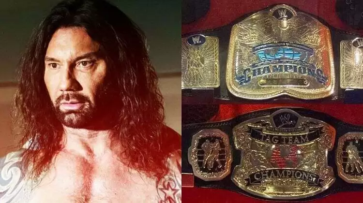 Batista and the old WWE Tag Team titles.