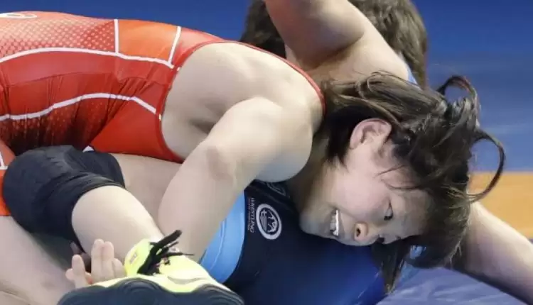 Coronavirus crashes Olympic party for wrestler-coach couple