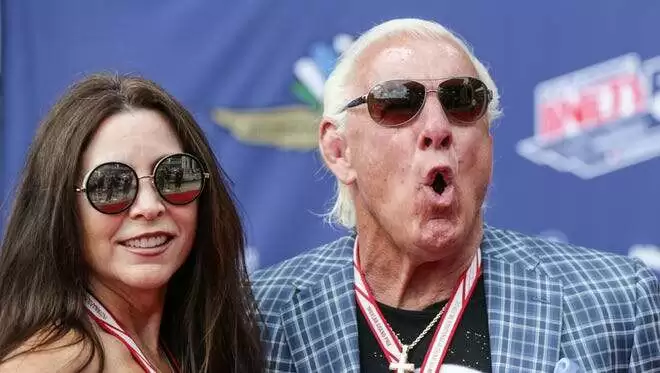 Retired wrestler Nature Boy Ric Flair and former WCW manager Wendy Barlow aka Fifi the Maid, walk the red carpet during the 101st running of the Indy 500 at Indianapolis Motor Speedway on Sunday May 28, 2017.